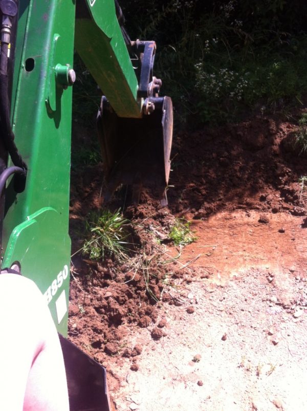 woman working the backhoe