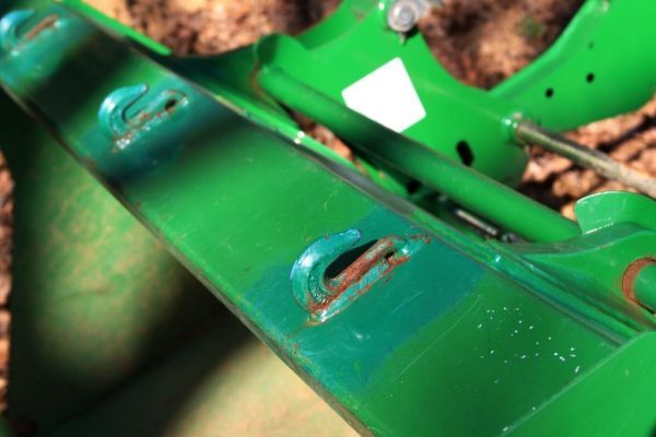 The hooks Rob welded onto the front end loader bucket have many uses. I use them for moving round bales without a hay spike.