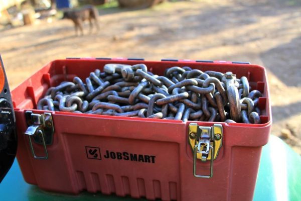 We keep the chains in a tool box mounted to the tractor fender.