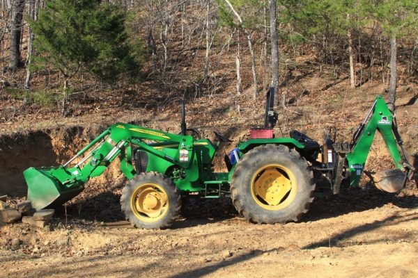 We move round bales without a hay spike with our tractor's front end loader.