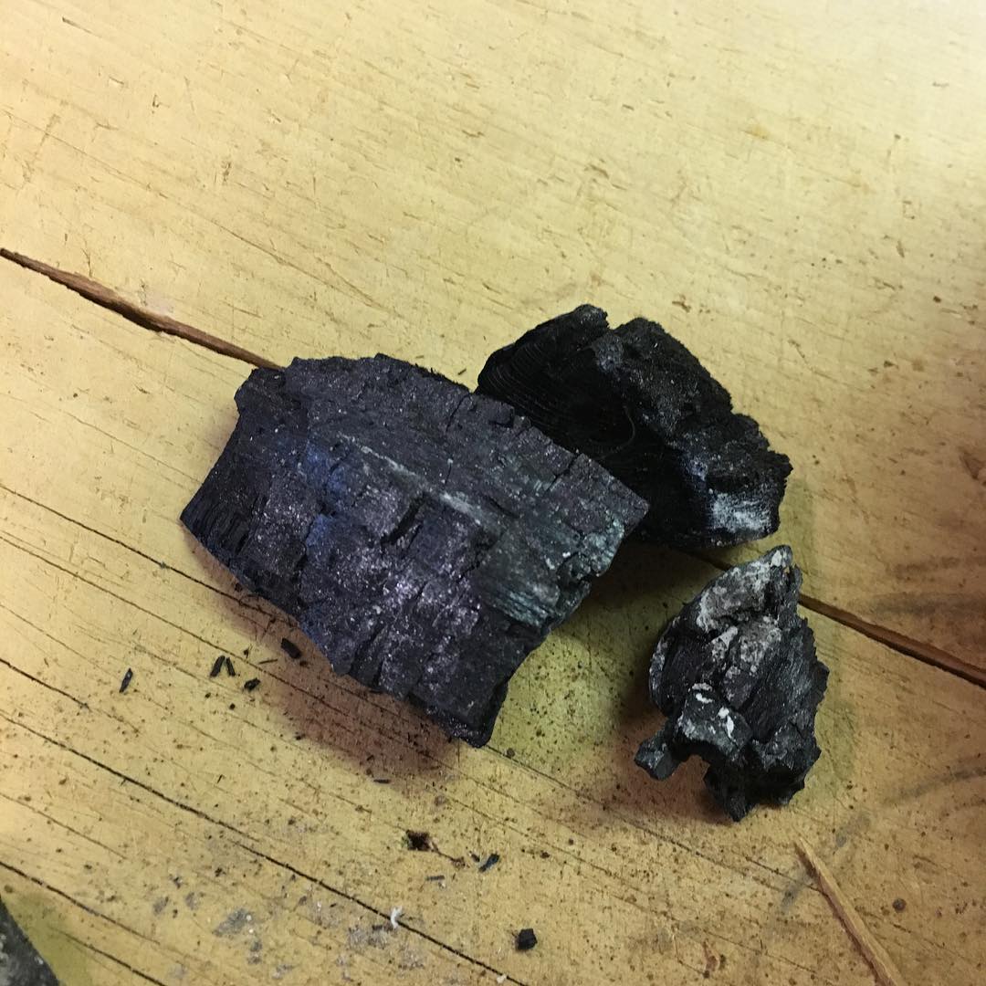 chunks of charred wood for making black paint.
