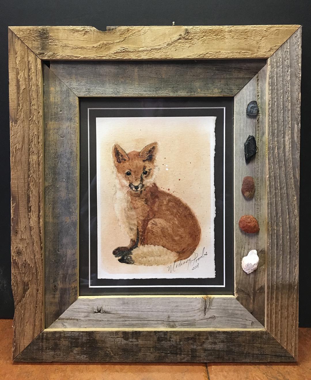 My fox painting, framed in old barnwood with rock pigment specimens.