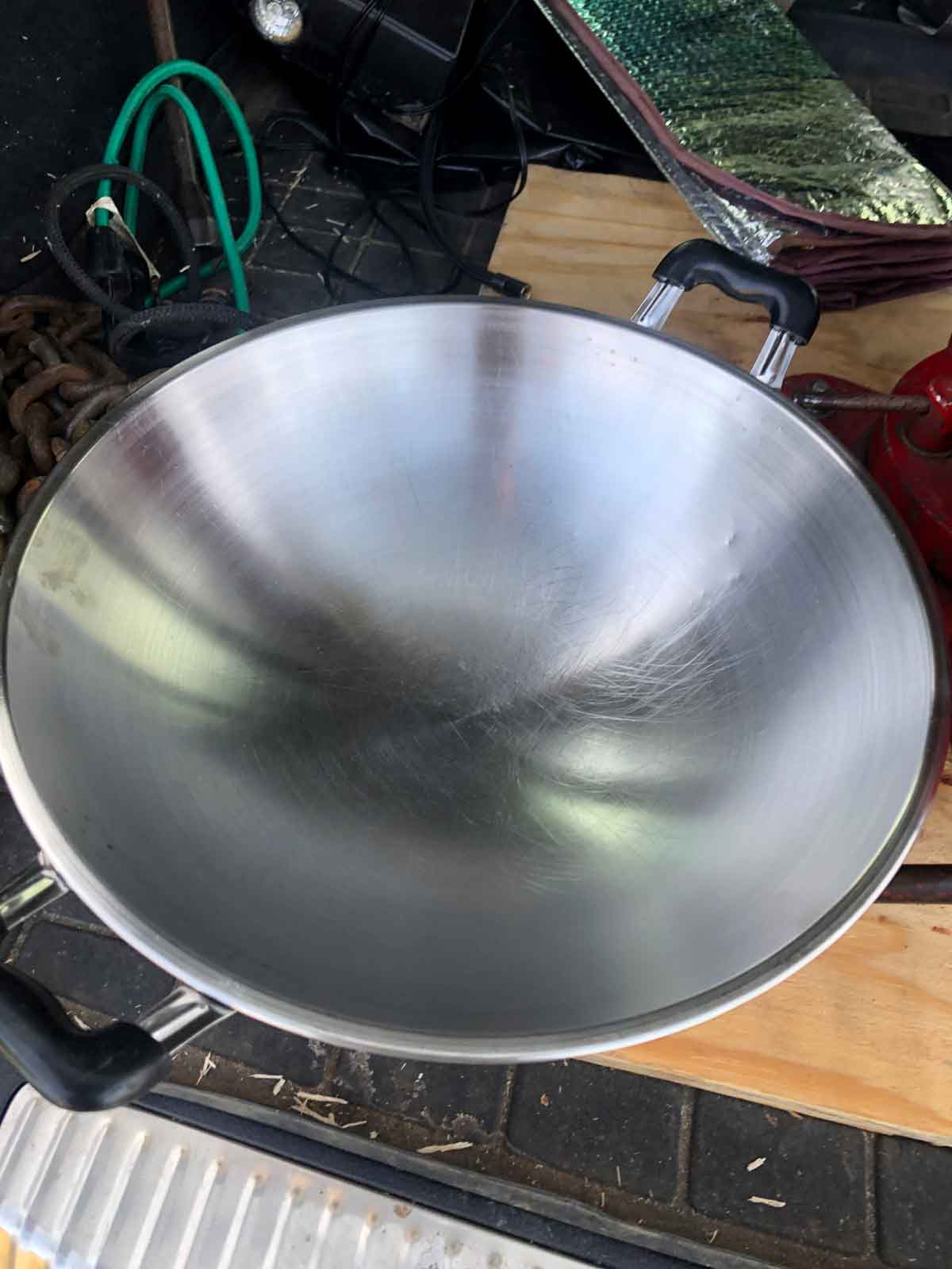 A stainless steel wok I use to gather the petals from the dayflower when I'm out foraging pigments.