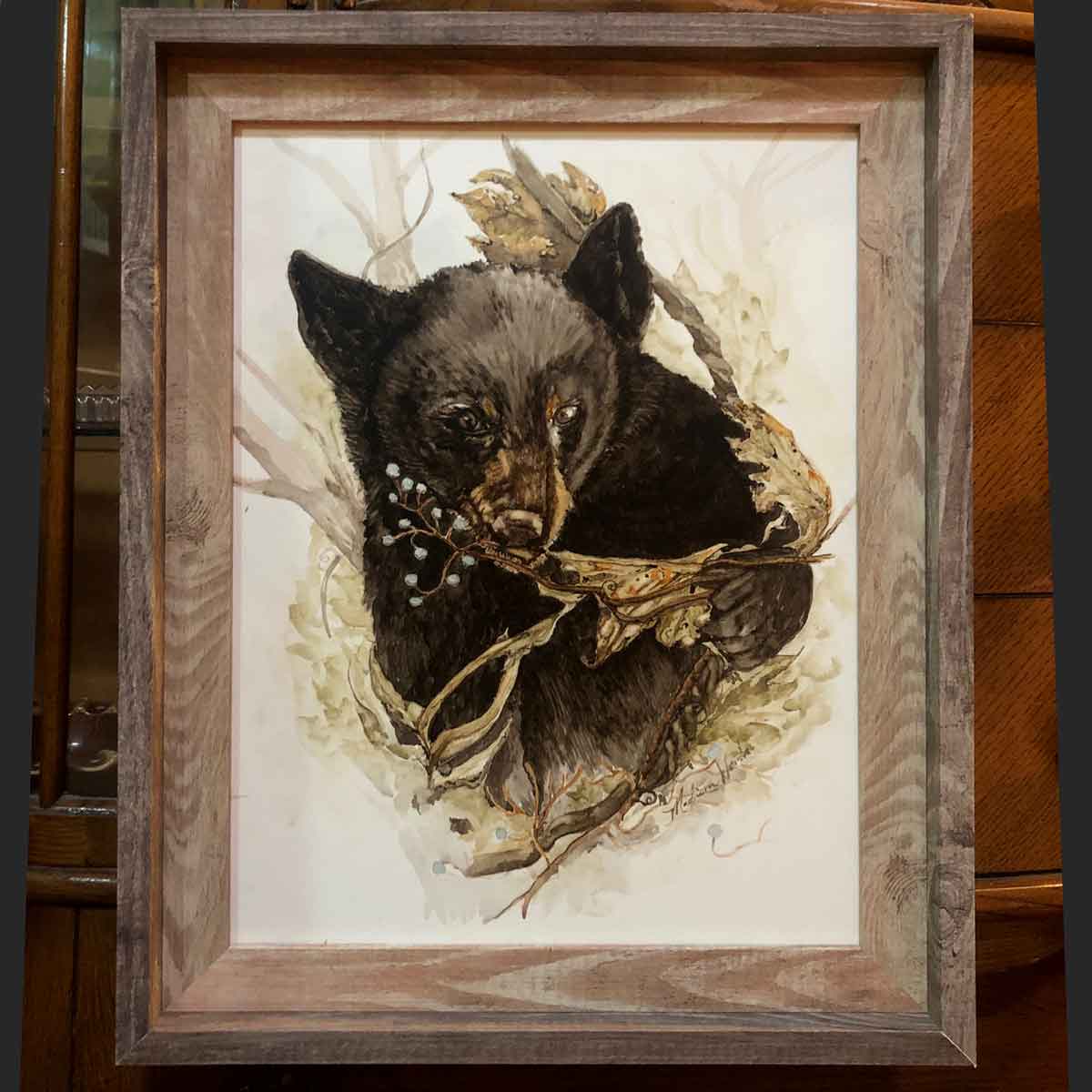 Framed bear painting.