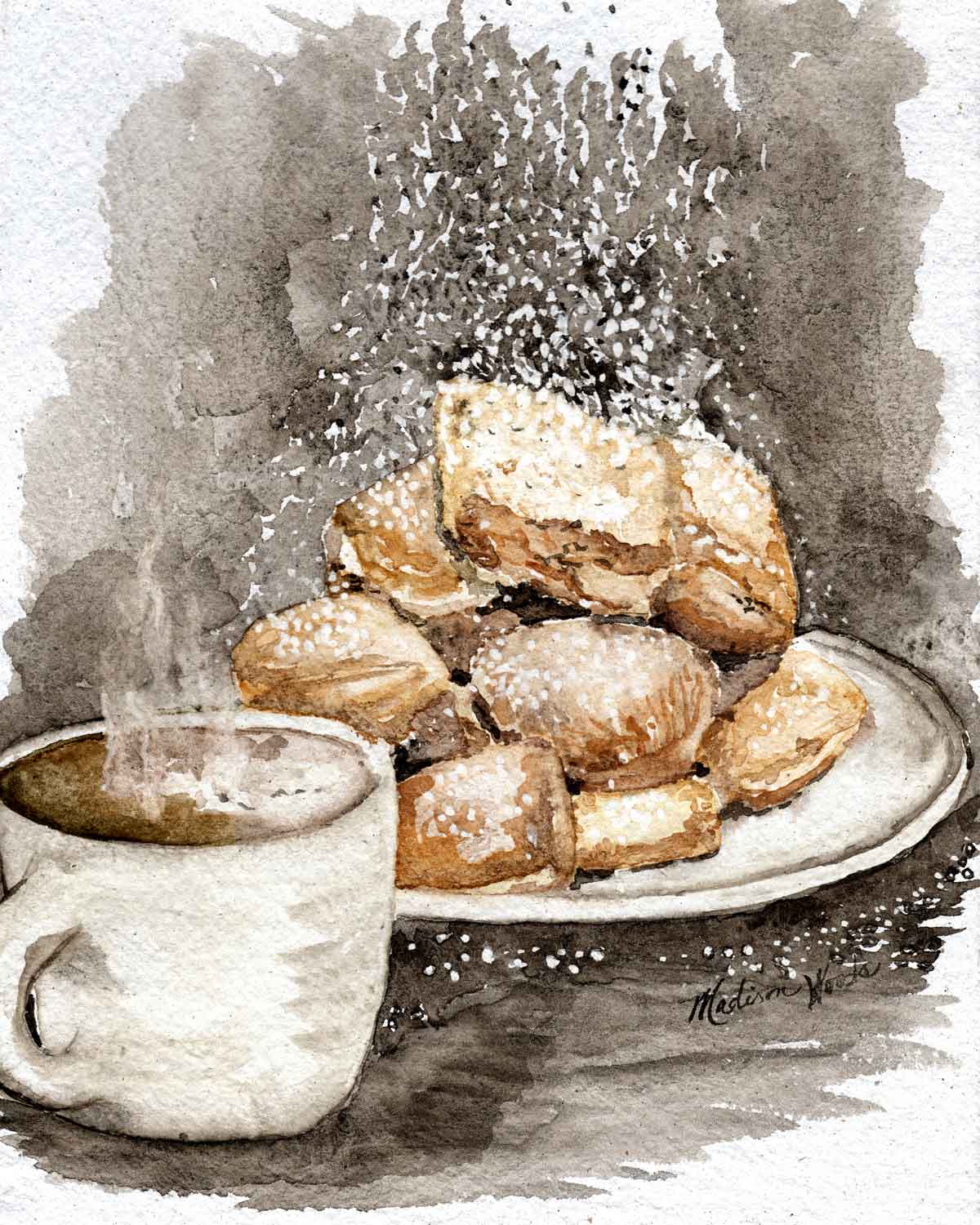 A plate of beignets and hot coffee.