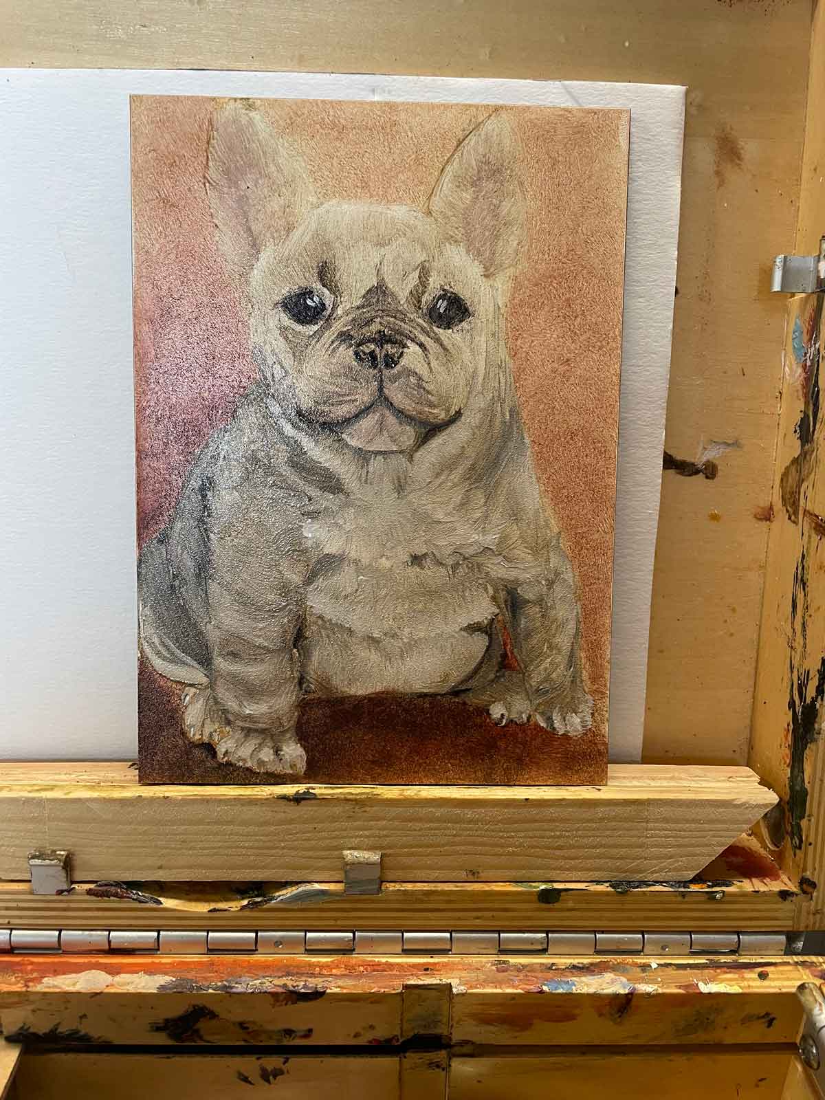 I'm almost done painting a French bulldog pup.