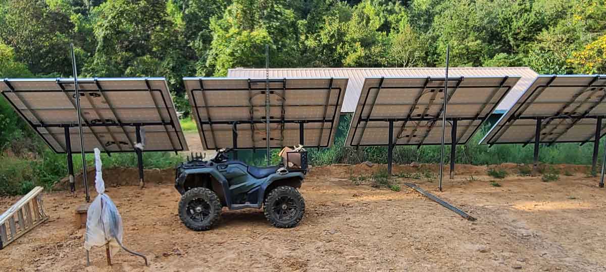 Roxann Riedel will be available to help you find a sustainable homesteading site in the Ozarks in 2024! Here's our solar array, the first row done.